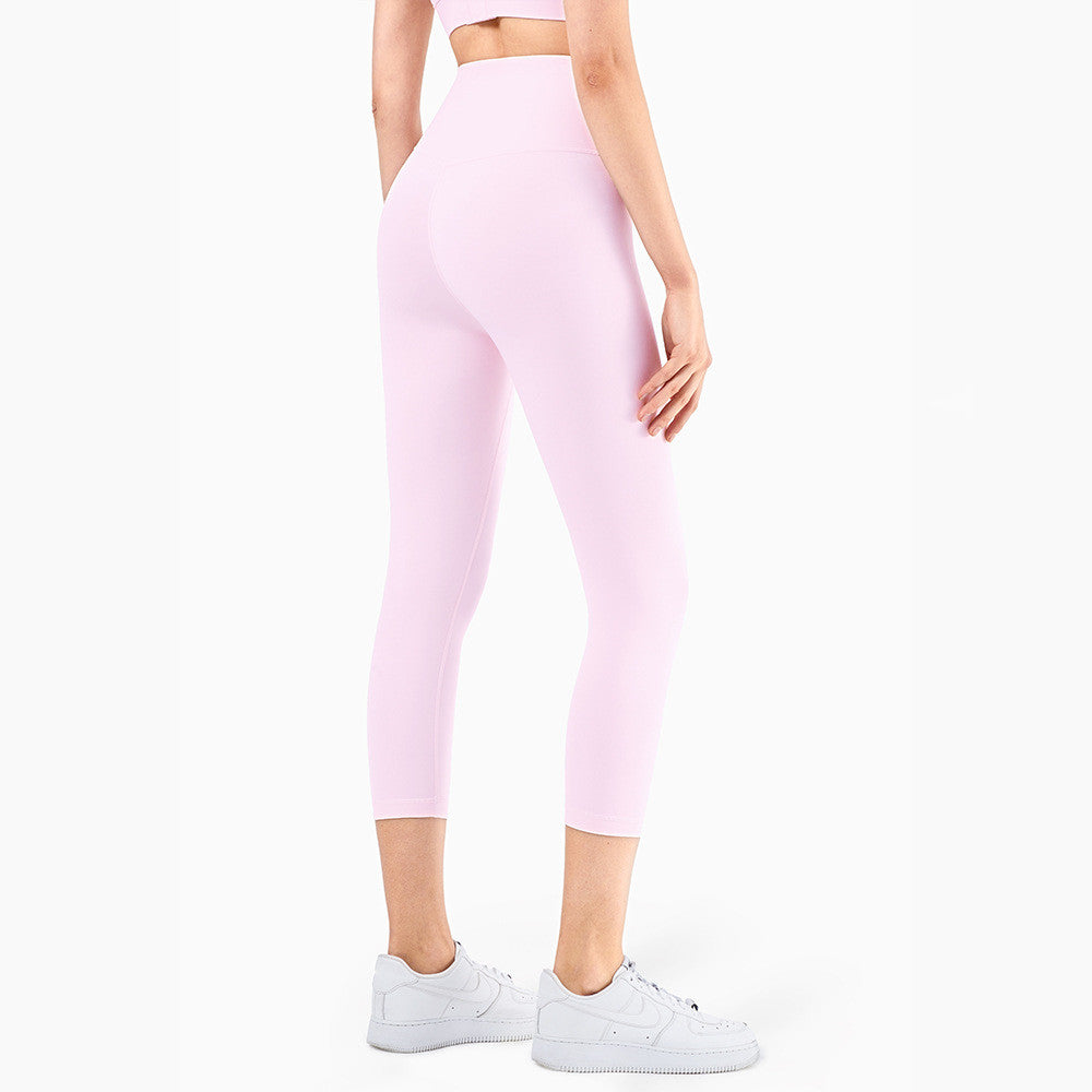 Peach Hips Fitness Cropped Leggings by Alvionz.com, showing the fitted waistband and peach-colored fabric with a seamless design.
