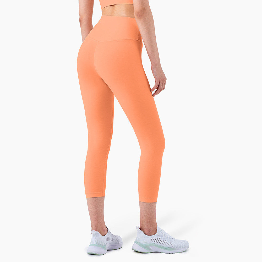 Peach Hips Fitness Cropped Leggings by Alvionz.com showing high-waisted peach-colored athletic leggings with a fitted design.