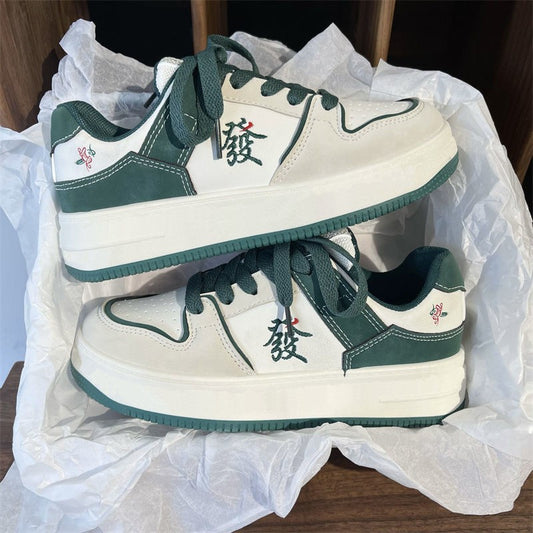 Men's casual fashion retro low top sneakers by Agate featuring flat bottoms and a stylish, relaxed design.