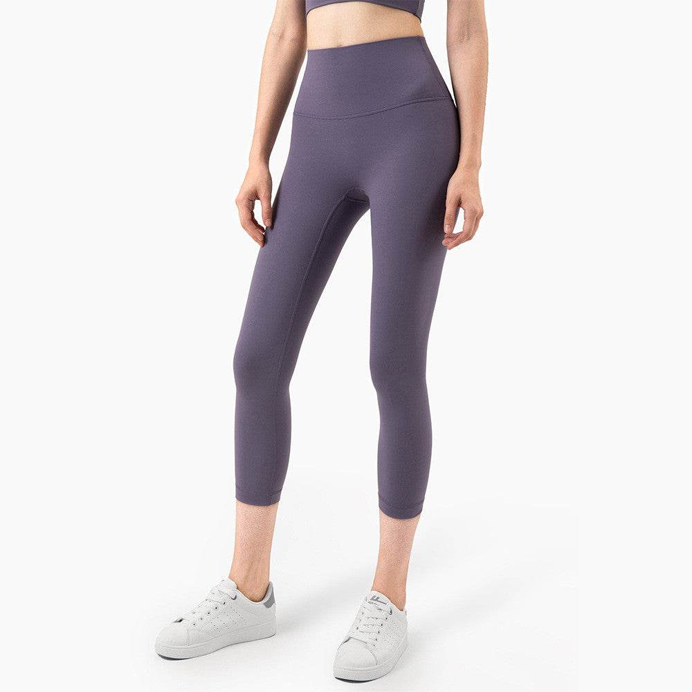 Peach Hips Fitness Cropped Leggings by Alvionz.com, showing a close-up of peach-colored, high-waisted athletic leggings with a fitted design.