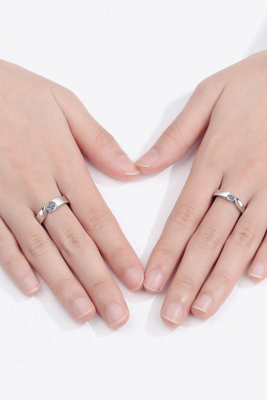 Rhodium-plated moissanite ring with sparkling gemstone setting, elegant jewelry piece showcasing intricate design and shine