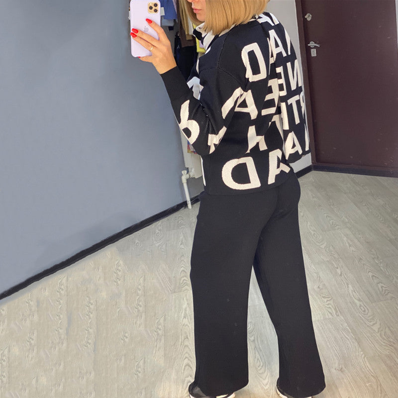 Black women's sport winter suit with sweater by Agate, featuring a cozy, fitted design for cold-weather activities.