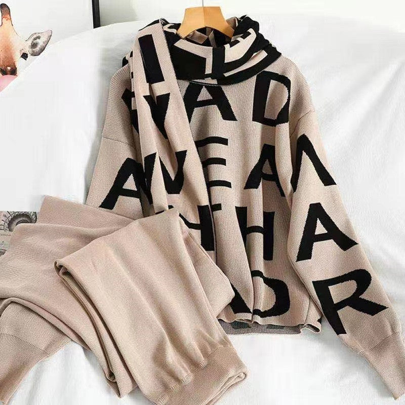 Black women's sport winter suit by Agate featuring a cozy sweater and athletic winter clothing for women.