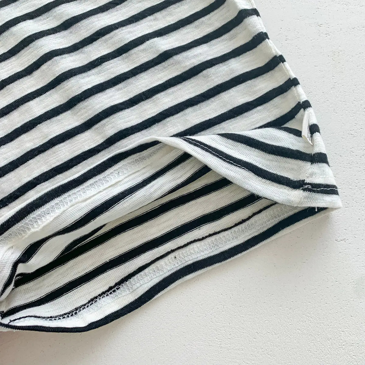 Red baby sleeveless vest with white stripes for toddlers and infants, made by Alvionz.de.
