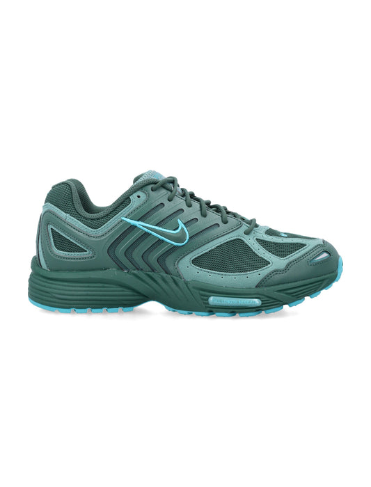 Green Nike round toe men's sneakers by Jade Ajax, lacing up for travel, running, and hiking activities.