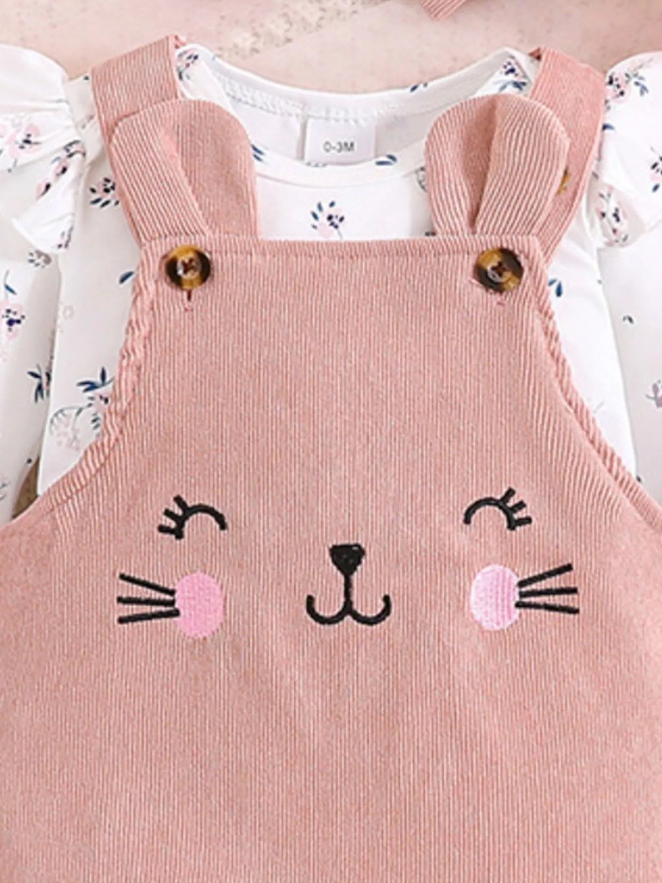 Children's floral print ruffle trim top, corduroy overalls, and headband set by Trendsi, featuring adorable and comfortable baby clothing.