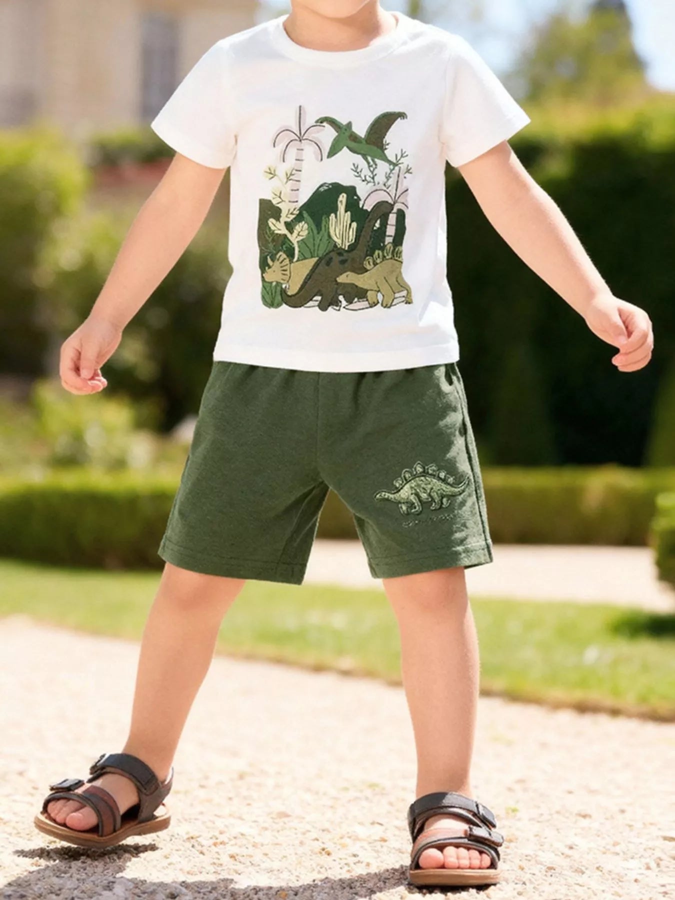 Children's army green graphic T-shirt and shorts set from Trendsi, featuring a playful design for kids aged 2 years.
