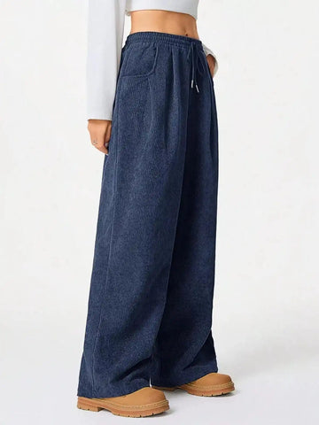 Blue casual corduroy wide-leg pants from Trendsi, featuring a relaxed fit and high waist for comfortable style.