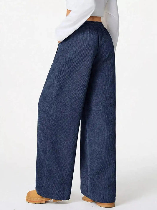 Blue casual corduroy wide-leg pants from Trendsi, featuring a relaxed fit and comfortable high-waisted design.