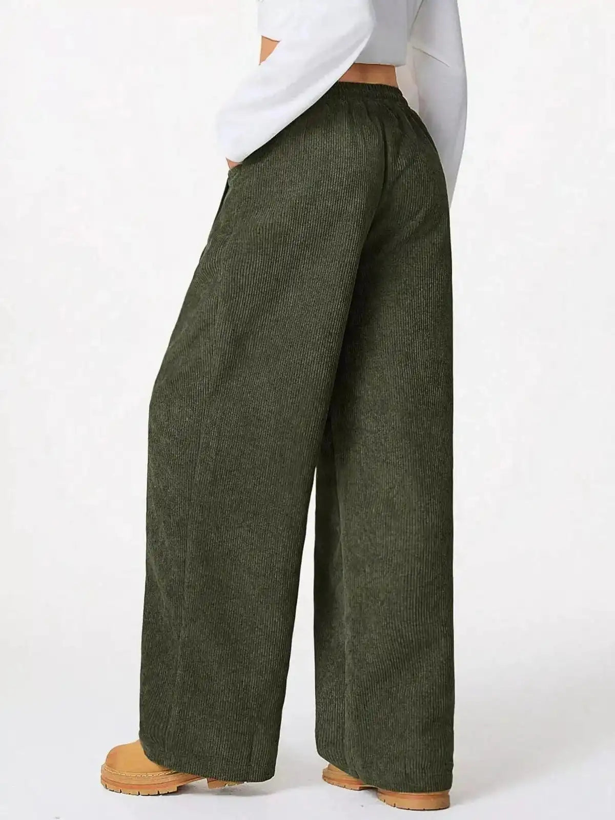 Blue casual corduroy wide-leg pants by Trendsi, showing relaxed fit and textured fabric on a plain background.