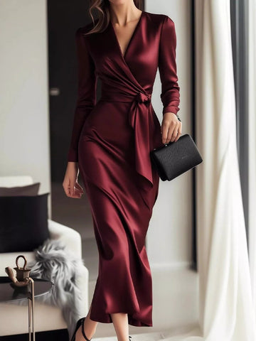 Burgundy satin wrap long sleeve midi dress by Trendsi, featuring a sleek design and elegant fit for sophisticated occasions.