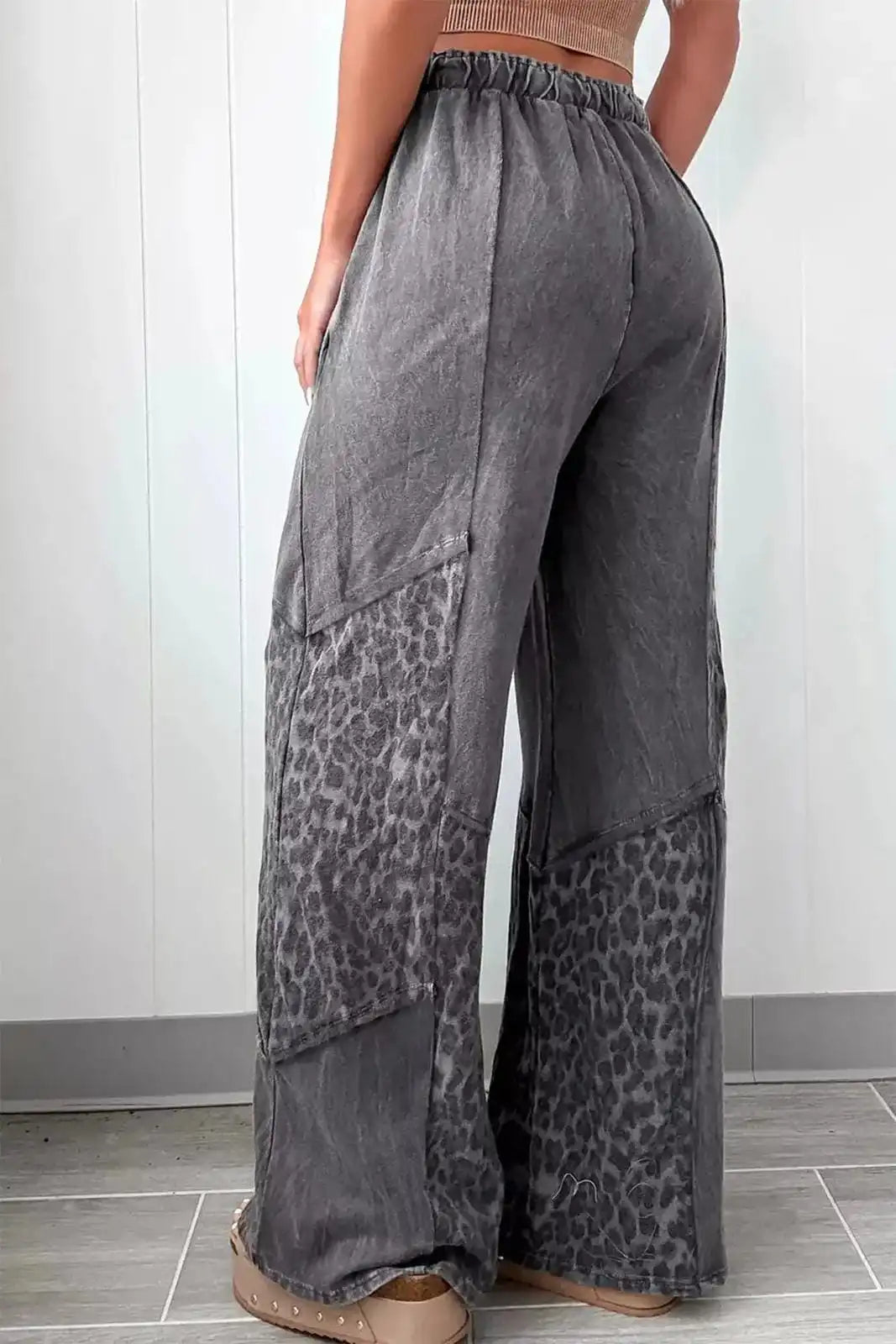 Dark gray mineral wash leopard patchwork loose pants by Trendsi, featuring relaxed fit and stylish animal print design.