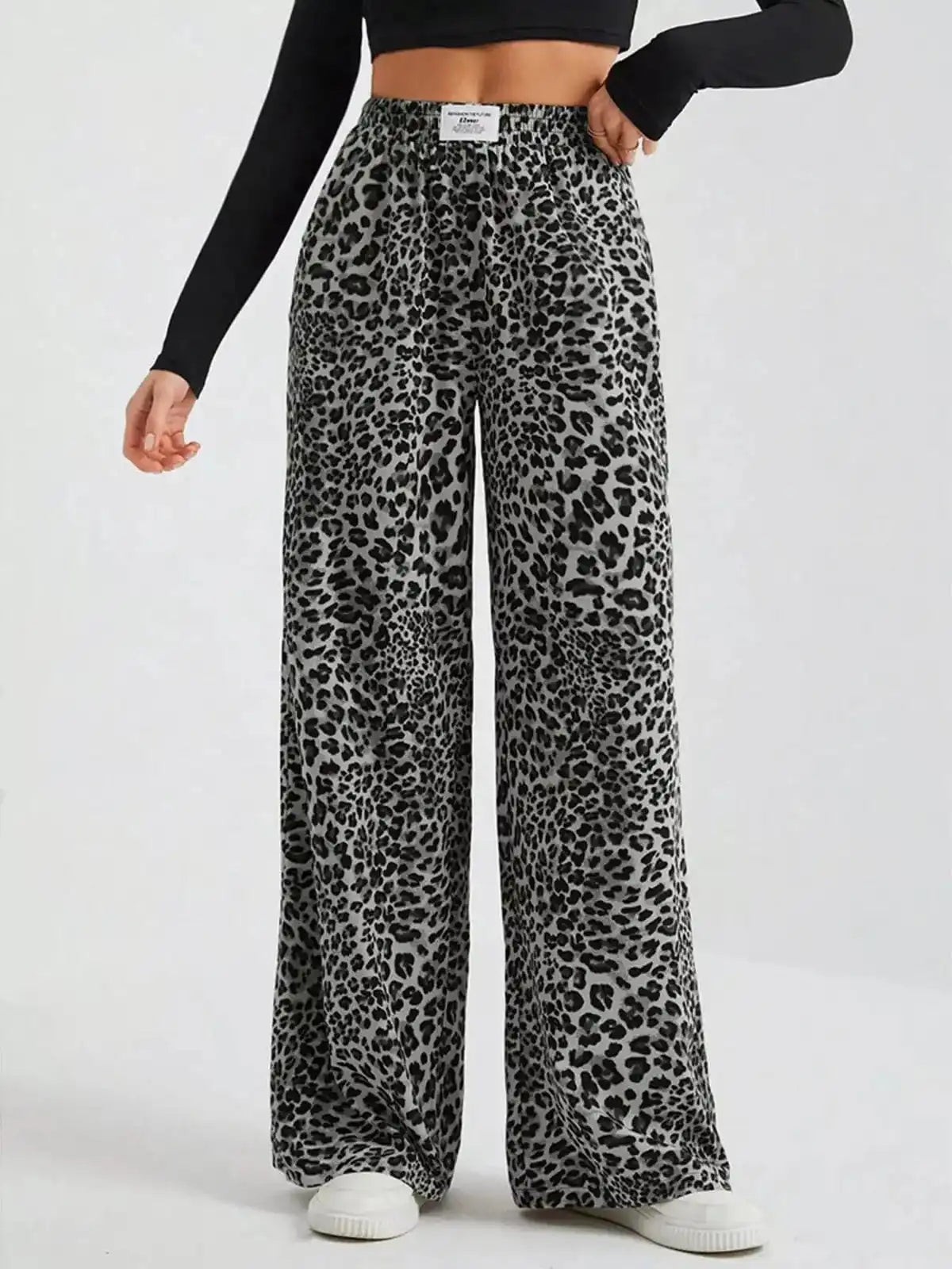 Plus size leopard print wide-leg pants by Trendsi, full length view showcasing the bold animal print and relaxed fit.