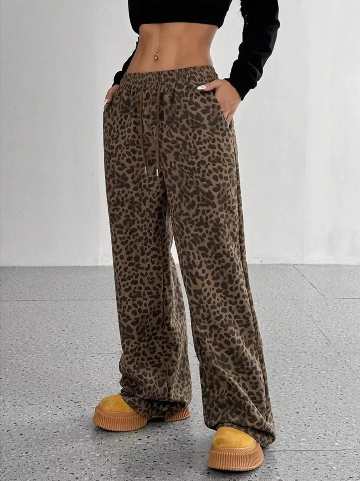 Full size leopard print wide leg pants by Trendsi, featuring bold leopard pattern and relaxed fit, plus size fashion.