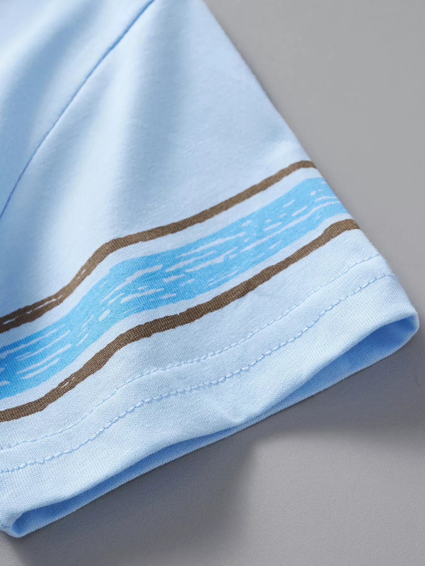 Light blue children's dinosaur round neck top and shorts set by Trendsi, perfect for casual wear and play.