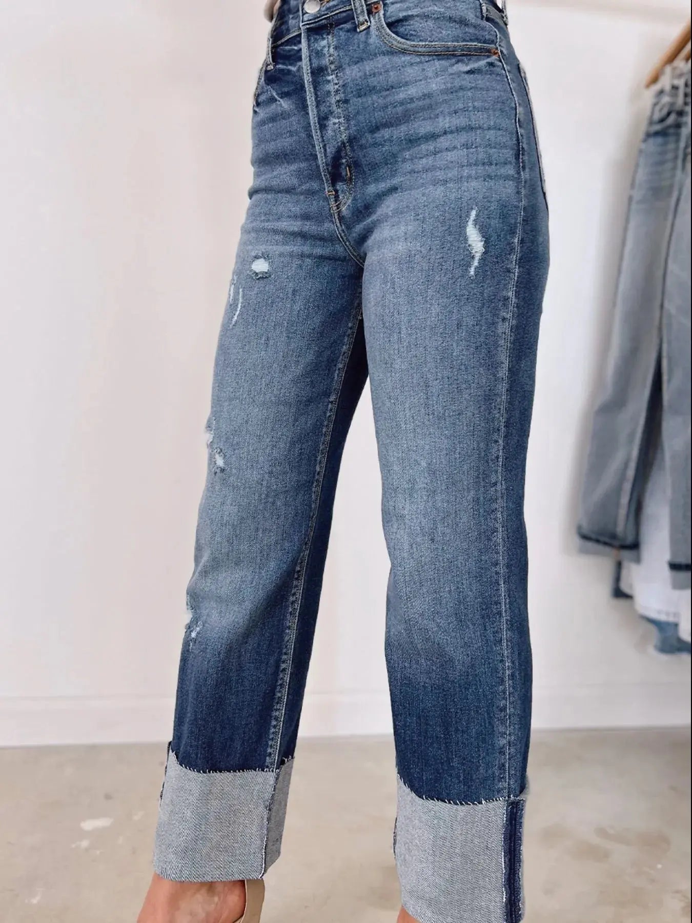 Light blue high waist distressed straight leg jeans from Trendsi, with frayed edges and classic fit, casual and stylish for everyday wear.