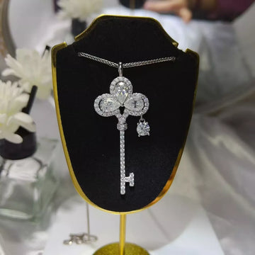 Sterling silver key necklace with 3.5 carat moissanite stone, featuring a 925 sterling silver chain and elegant design