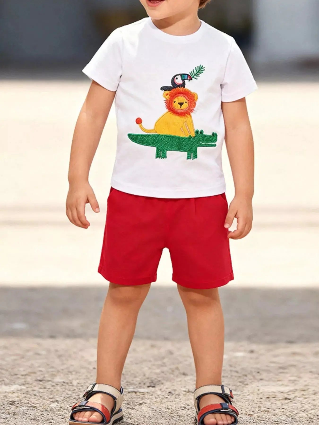 White children's animal-themed round neck T-shirt by Trendsi, featuring playful animal print on soft fabric for kids.